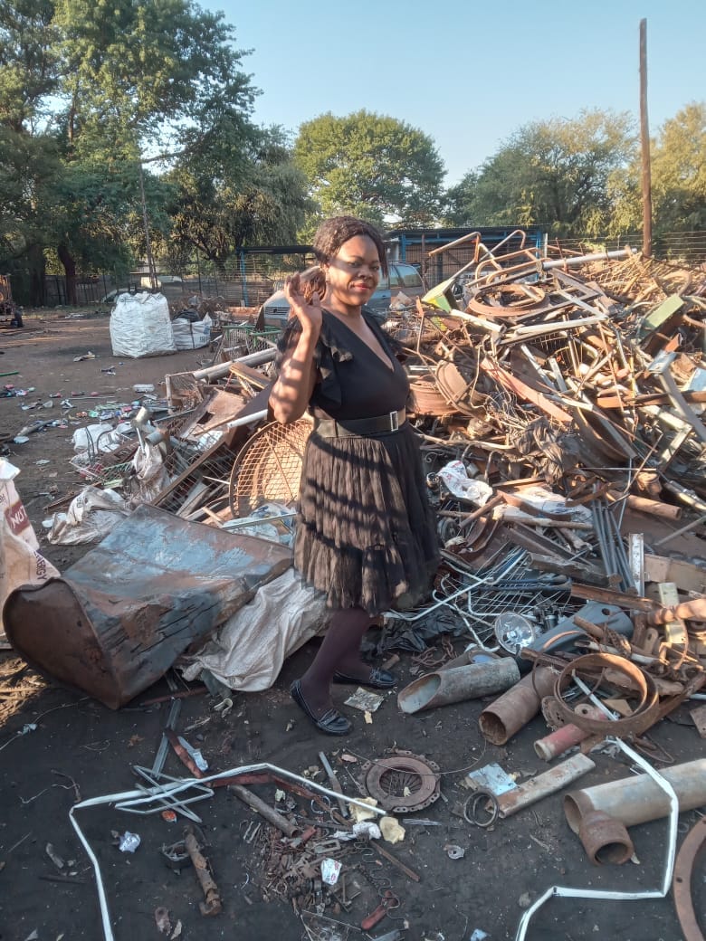 Dombo Recycler team member standing at a scrap metal site