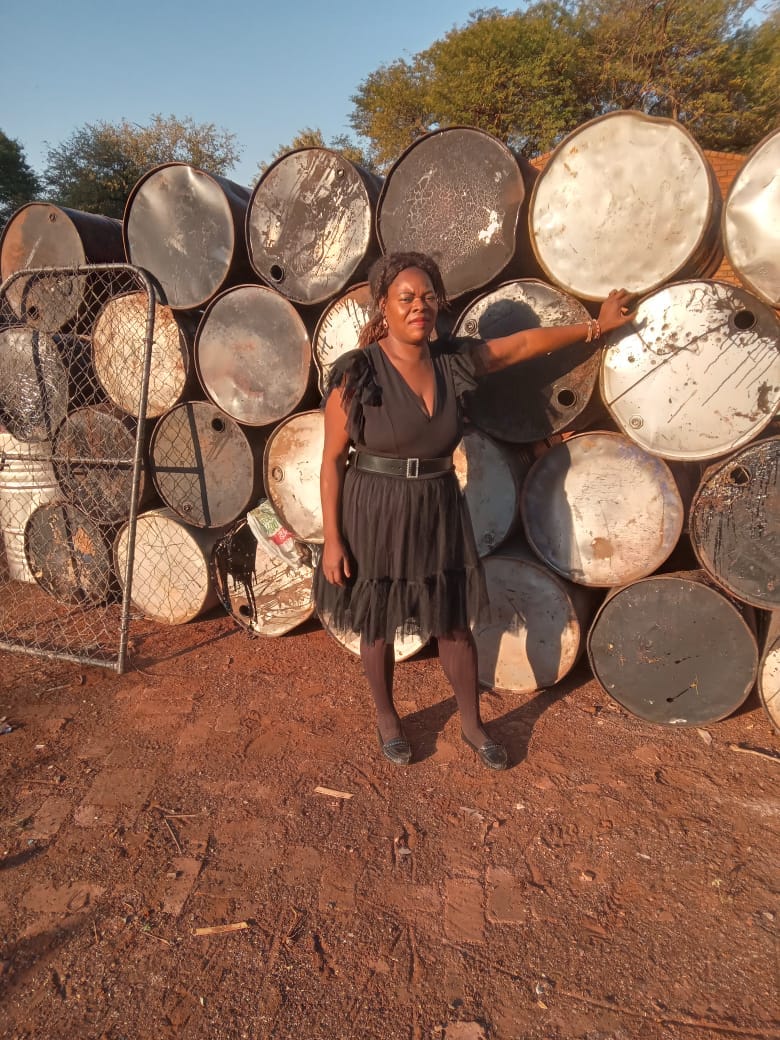 Large metal drums stored at a recycling yard